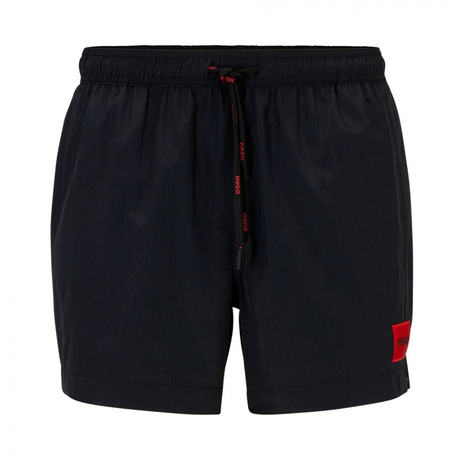 costume-da-bagno-etichetta-con-logo-rosso